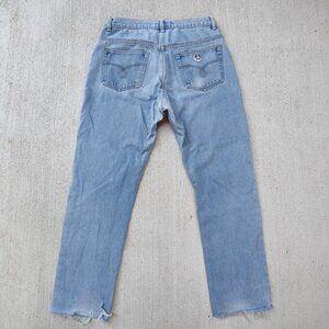 Vintage designer 'Moschino JEANS' light wash distressed denim jeans men's 32